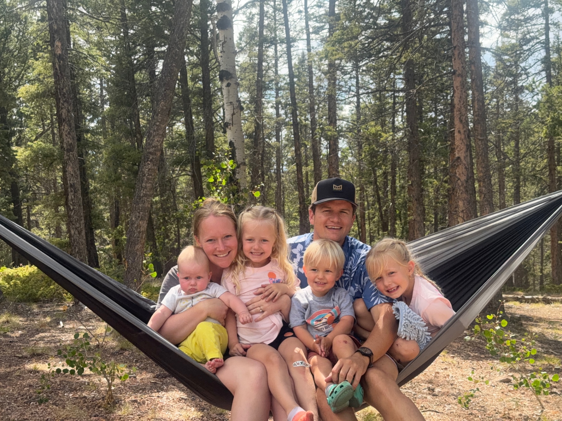 Thomas Wadsworth with his wife and four children in a Colorado orchard